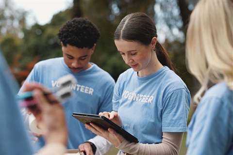 Volunteer speaking on the phone with a community member